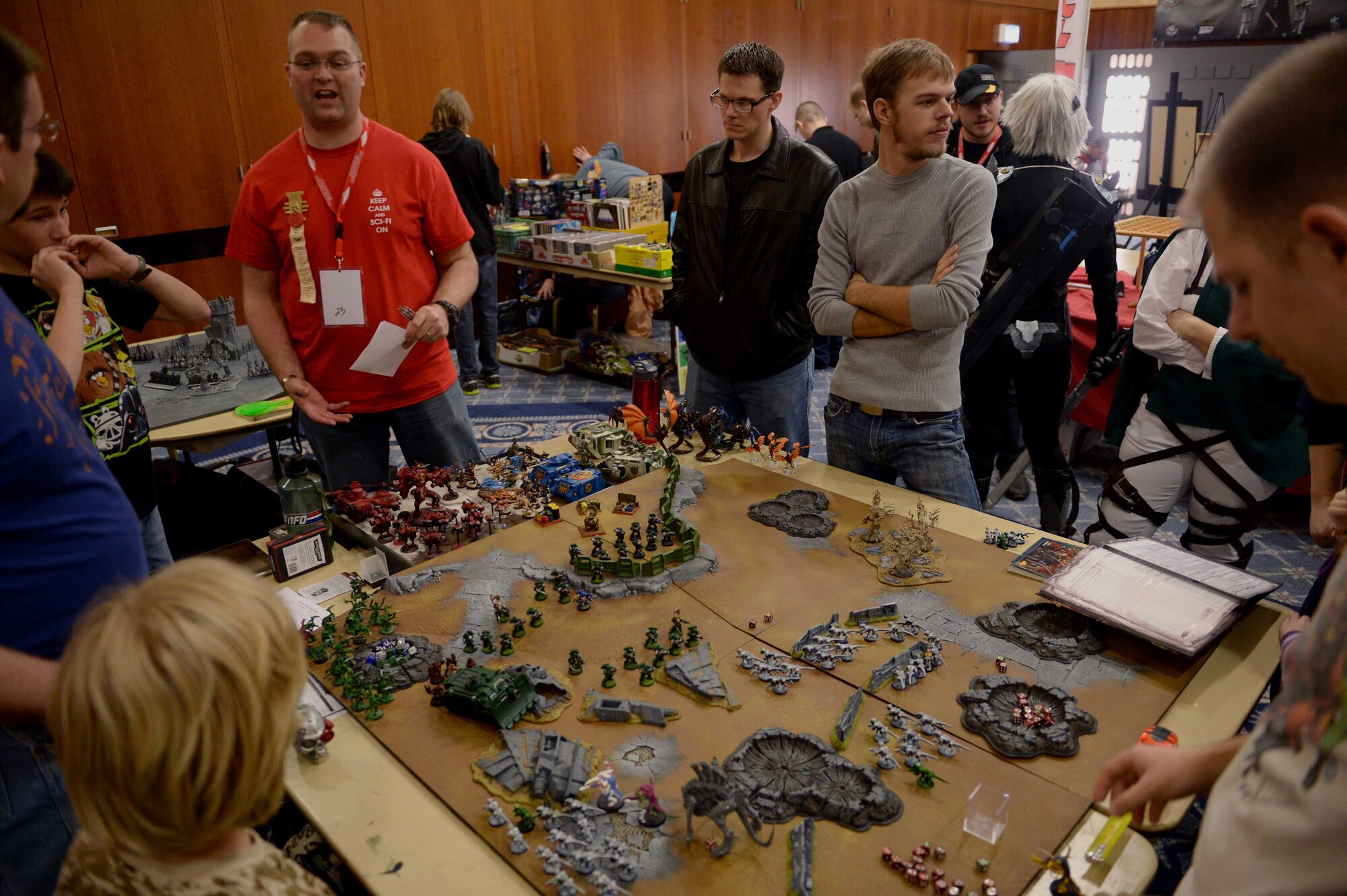 Spangdahlem community members play Warhammer 40k, a tabletop game, during Operation Sci-Fi Con 2015 in the Landscheid Room at Club Eifel on Spangdahlem Air Base, Germany, Nov. 15, 2014. Experienced players introduced newcomers to the game and gave them the opportunity to try it out. (U.S. Air Force photo by Airman 1st Class Timothy Kim/Released)