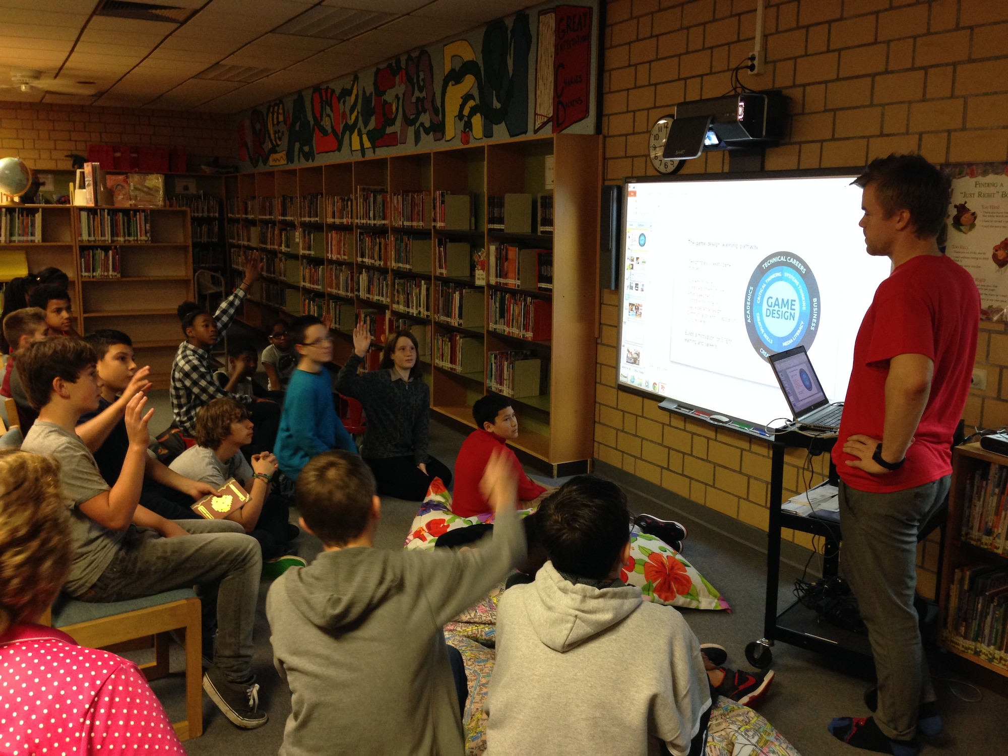 Santeri Koivisto, MinecraftEdu chief executive officer and co-founder, answers questions from the Kaiserslautern Middle School Science, Technology, Engineering and Math Club at Vogelweh Elementary School. Koivisto and another member of the TeacherGaming, LLC are traveling to different schools in Europe to help teachers raise awareness and excitement for computer programming. (Courtesy photo)