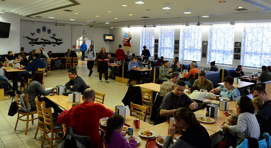 Members of the Spangdahlem community eat lunch at the Mosel Dining Facility during the “Messlords” luncheon at Spangdahlem Air Base, Germany, Nov. 15, 2014. The free luncheon went from noon to 2 p.m. and was open to the entire base. (U.S. Air Force photo by Airman 1st Class Luke Kitterman/Released)