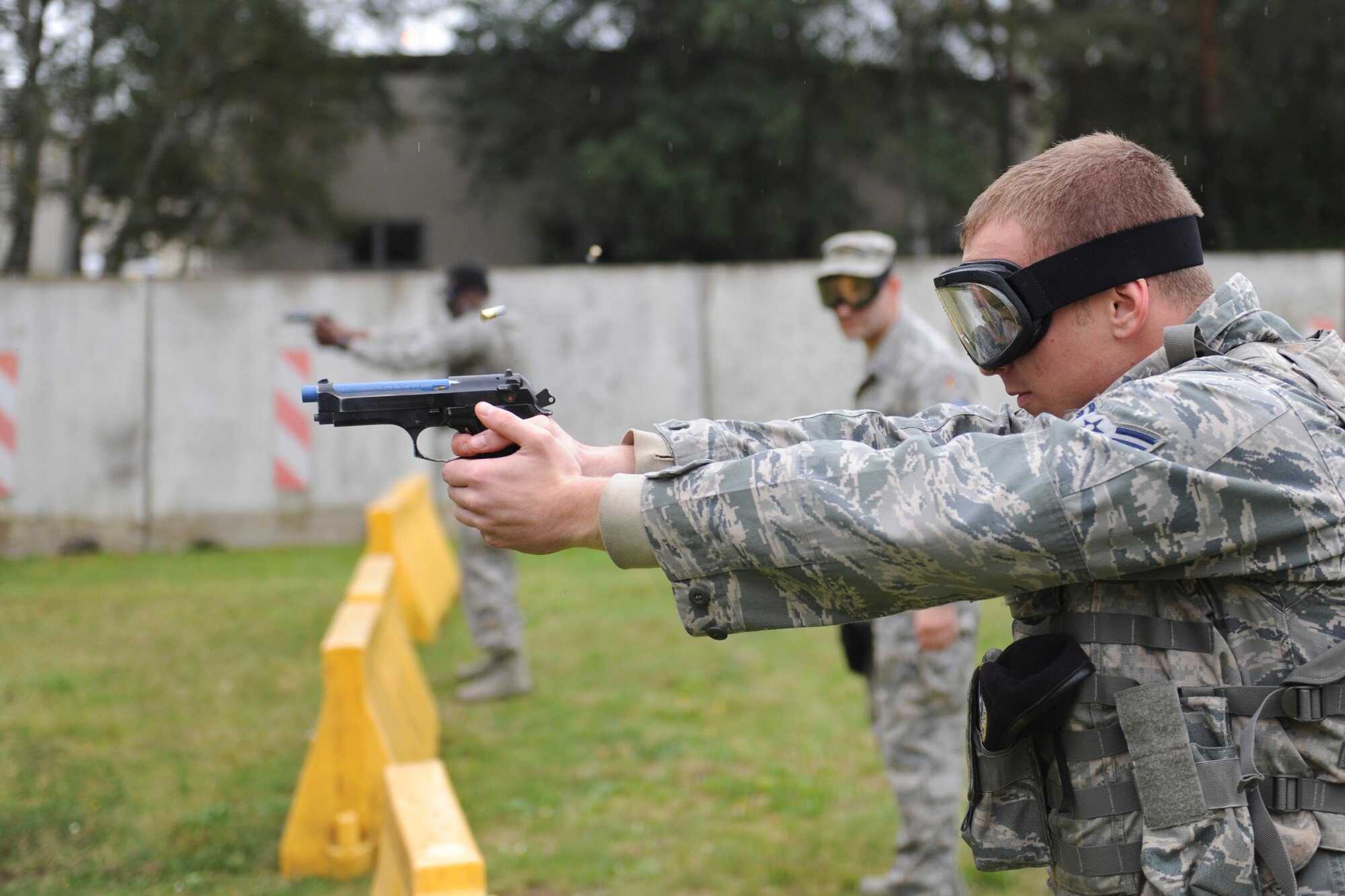 Airman 1st Class Zachary Handley, 86th Security Forces Squadron member, fires a trainer weapon at a target during “Shoot, Move, Communicate” training on Ramstein Air Base, Germany, Oct. 10, 2014. The 86th SFS play a huge part in the protection of the people in the Kaiserslautern Military Community, which is approximately 54,000 people. (U.S. Air Force photo/Airman 1st Class Michael Stuart)