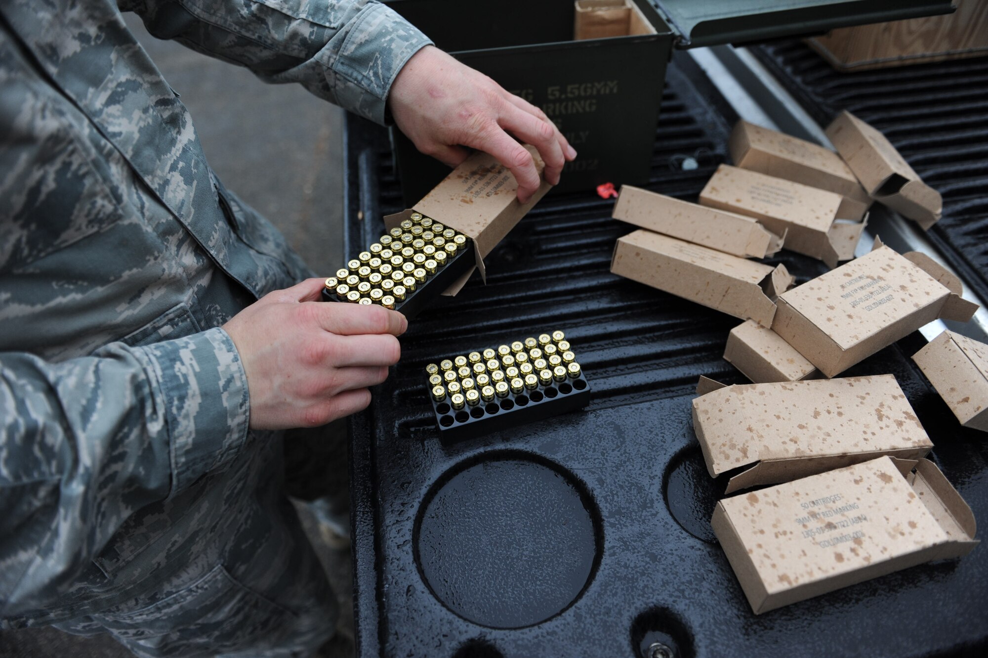An 86th Security Forces Squadron member prepares trainer bullets for trainees during “Shoot, Move, Communicate” training on Ramstein Air Base, Germany, Oct. 10, 2014. The 86th SFS is responsible for protecting the people, resources and property on Ramstein, 24 hours a day, seven days a week. (U.S. Air Force photo/Airman 1st Class Michael Stuart) 