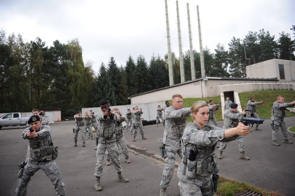 Members of the 86th Security Forces Squadron participate in “Shoot, Move, Communicate” training on Ramstein Air Base, Germany, Oct. 10, 2014. The focus of the training was to ensure defenders know the fundamentals of shooting, moving and communicating with their brothers-in-arms in combat scenarios. (U.S. Air Force photo/Airman 1st Class Michael Stuart)