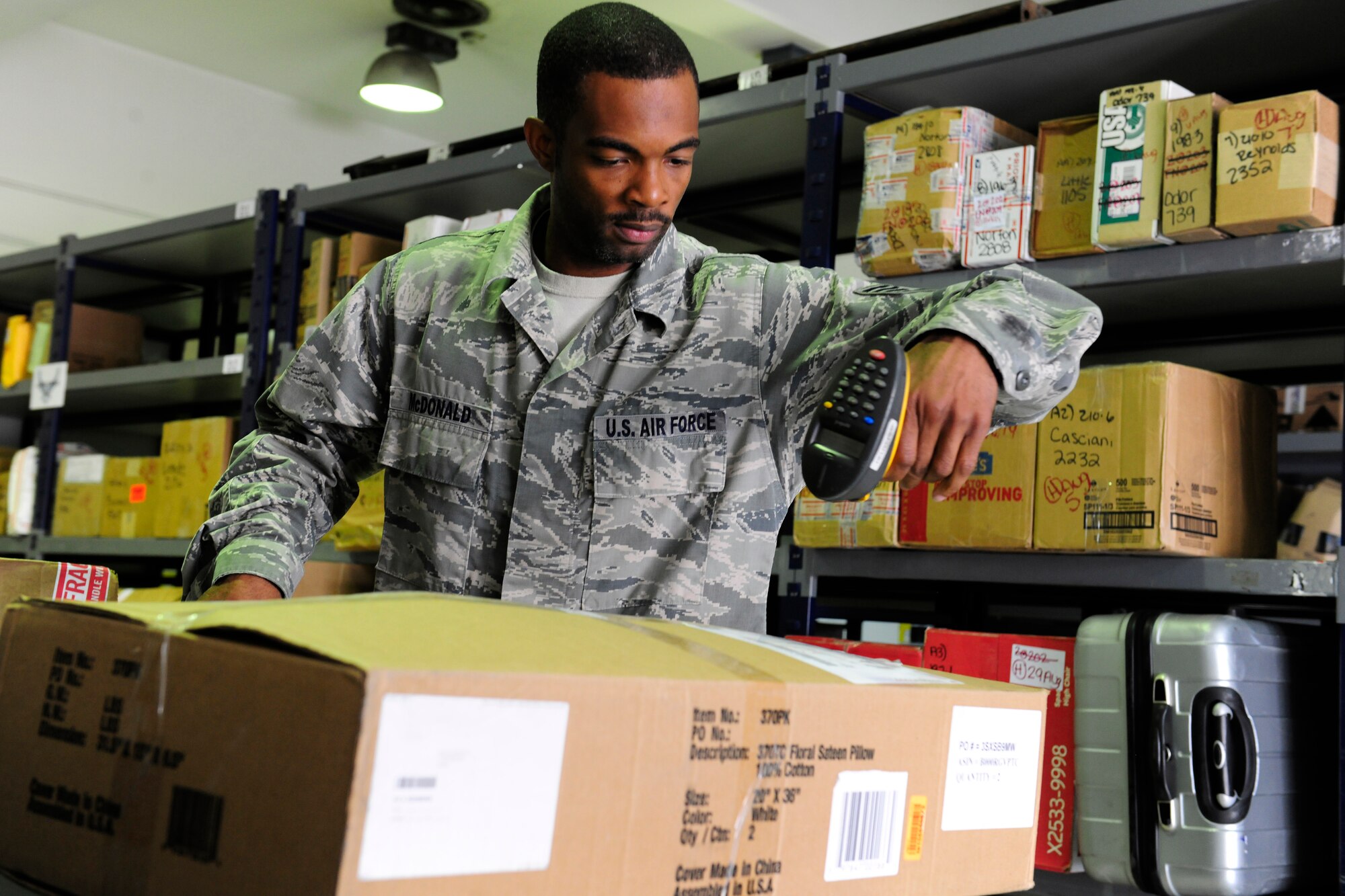 Staff Sgt. Samuel McDonald, 39th Communications Squadron Official Document Center non-commissioned officer in charge, scans in a shipment of packages July 30, 2014, at Incirlik Air Base, Turkey. The tracking system helps to ensure that all packages arriving and being shipped from Incirlik AB make it to their destination in a timely manner. (U.S. Air Force photo by Staff Sgt. Eboni Reams/Released)