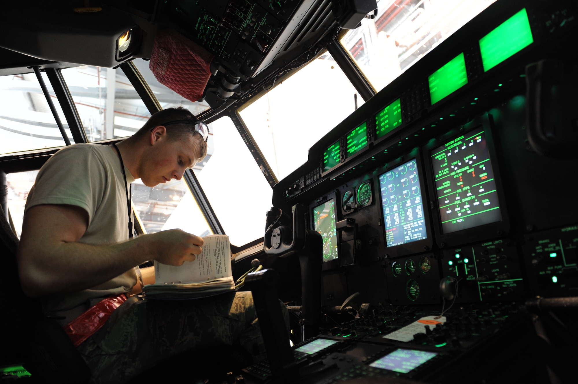 Senior Airman Jacob Osborne, 86th Maintenance Squadron hydraulics systems journeyman, applies electrical power to a C-130J Super Hercules on Ramstein Air Base, Oct. 21, 2014. In order to check the hydraulic systems before or after a flight, the hydraulics journeymen must turn on the electrical systems and check the hydraulics from the cockpit as well as outside of the aircraft. (U.S. Air Force photo/Airman 1st Class Michael Stuart)