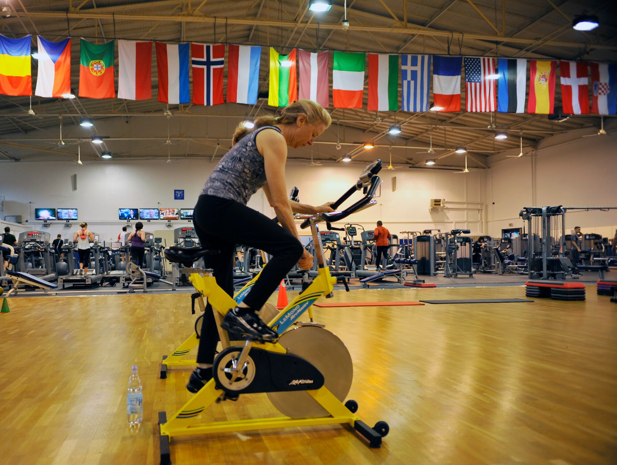 Loriann Tierney, PT Boot Camp attendee, pedals on a stationary bicycle during a PT Boot Camp class, Nov. 7, 2014 at Ramstein Air Base, Germany. The class is free and is offered at the Northside Fitness Center. (U.S. Air Force photo/Airman Larissa Greatwood)