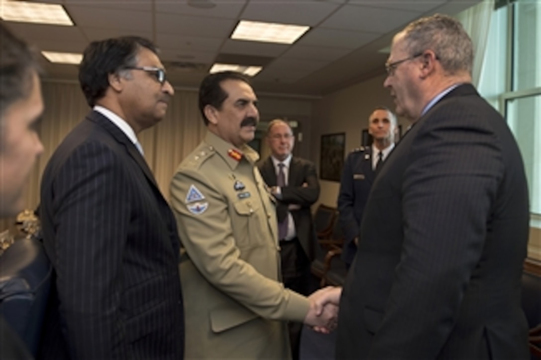 U.S. Deputy Defense Secretary Bob Work greets Pakistani Army Chief of Staff Gen. Raheel Sharif as he arrives at the Pentagon, Nov. 18, 2014. The two defense leaders met to discuss issues of mutual importance.