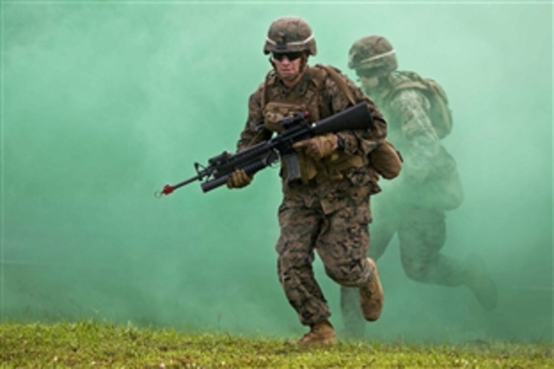 U.S. Marines and Brunei forces conduct military operations in urban terrain training during Cooperation Afloat Readiness and Training Brunei 2014 on Camp Penanjong, Brunei, Nov. 13, 2014. The annual bilateral exercise includes the U.S. Navy, U.S. Marine Corps and the armed forces of nine partner nations, including Bangladesh, Brunei, Cambodia, Indonesia, Malaysia, the Philippines, Singapore, Thailand and Timor-Leste.