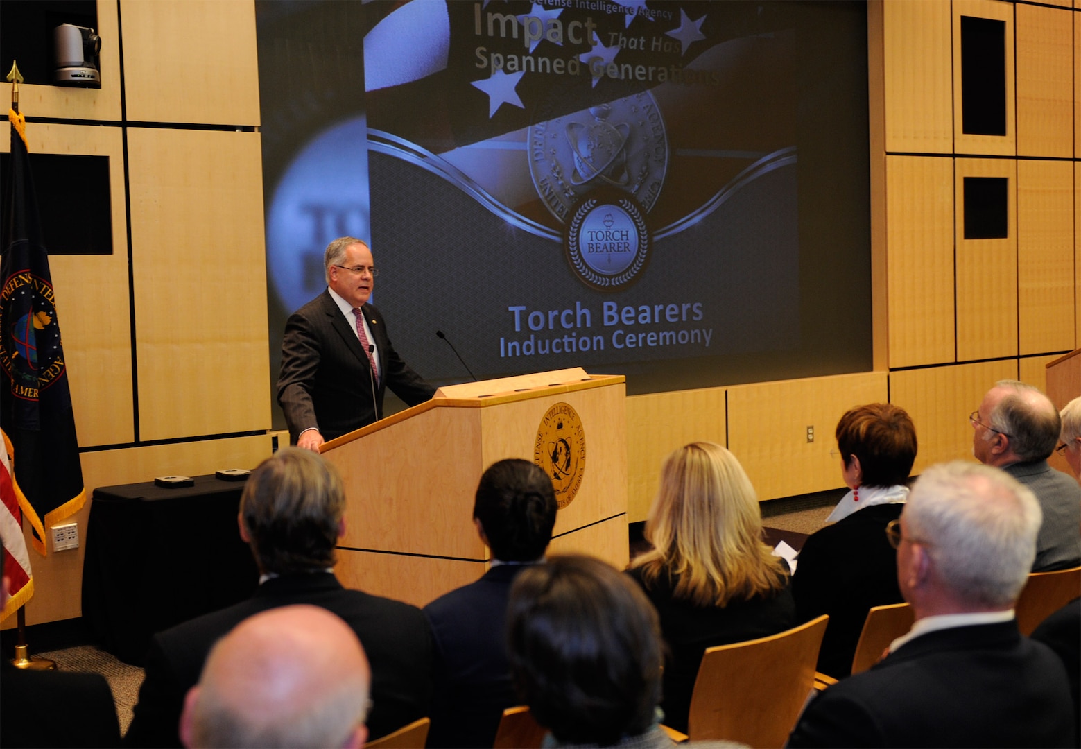 DIA Acting Director David Shedd leads the Torch Bearers Induction Ceremony Nov. 13, which recognized three former employees for their exceptional contributions to the agency.