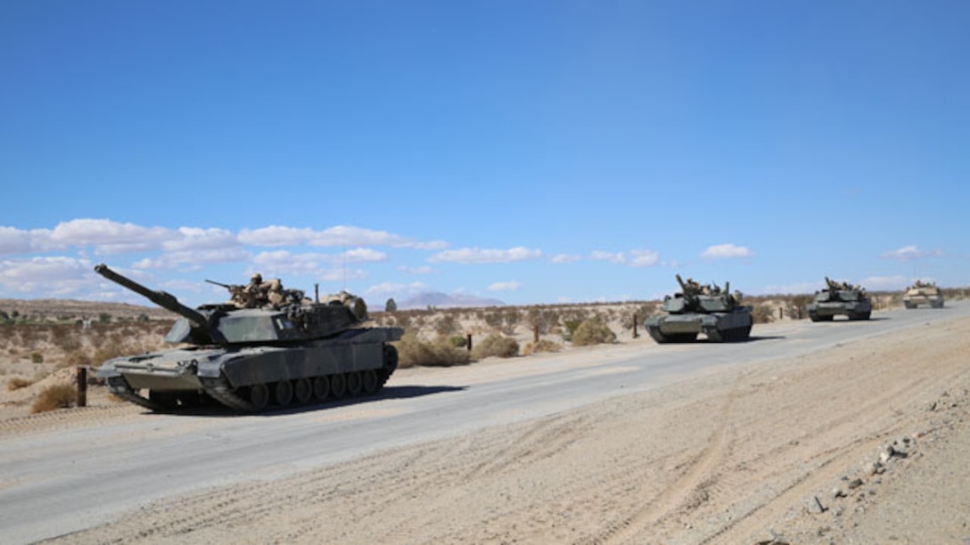 Marines with Company A, 1st Tank Battalion, 1st Marine Division, conduct a convoy to a staging area in preparation for the Tank Mechanized Assault Course during Integrated Training Exercise 1-15 aboard Marine Corps Air Ground Combat Center Twentynine Palms, Calif., Nov. 2, 2014. Company A Marines worked with infantry, mortars and air support during their assault.