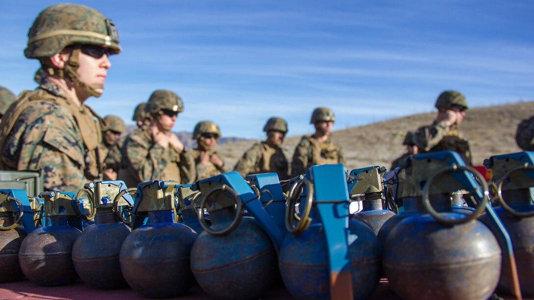 Marines with Headquarters Battery, 5th Battalion, 11th Marine Regiment, listen to a safety brief during a hand grenade training exercise aboard Marine Corps Base Camp Pendleton, Calif., Nov. 18, 2014. The event helped Marines of 5/11 refresh their basic combat skills and maintain their combat mindsets.