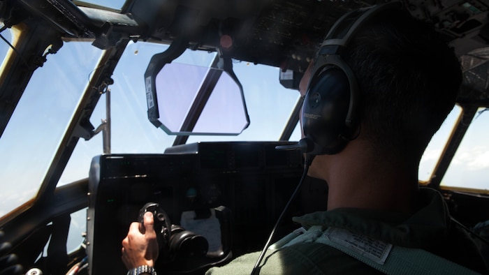 Capt. Karlo Landrau, a Cleveland native, looks out over the Australian Outback as he flies a Marine Aerial Refueler Transport Squadron 152 KC-130J “Hercules” from Darwin to Brisbane Nov 10. Marines and aircraft from VMGR-152, Marine Medium Tiltrotor Squadron 265 and VMM-262 flew approximately 4,700 miles from Okinawa, Japan to Brisbane to provide aerial support for President Barack Obama while he attended the G20 Summit. With an area of operations spanning 105 million square miles, the Hercules and MV-22 “Osprey” team are vital to commanders needing to get Marines and equipment to far flung locations quickly. Landrau is a pilot with VMGR-152. 