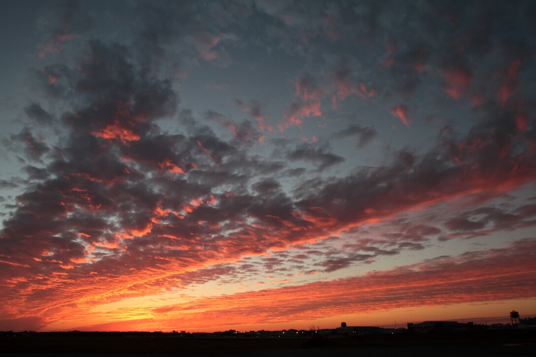A view of the southeast side of runway five and a colorful sunset above Marine Corps Air Station Cherry Point, N.C., Nov. 18, 2014. 
Cherry Point is home to 2nd Marine Aircraft Wing and several of its squadrons. Cherry Point's runways operate 24/7, 365 days each year, and the air station hosts squadrons that specialize in air-to-ground attack support; electronic warfare; aerial transport and refueling; and sea and land search and rescue.  
