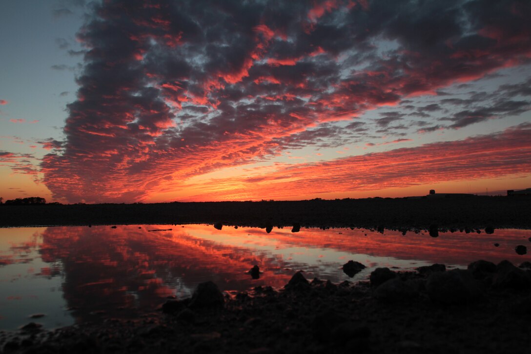 A southwest view along runway five shows a colorful sunset above Marine Corps Air Station Cherry Point, N.C., Nov. 18, 2014. 
Cherry Point is home to 2nd Marine Aircraft Wing and several of its squadrons. Cherry Point's runways operate 24/7, 365 days each year, and the air station hosts squadrons that specialize in air-to-ground attack support; electronic warfare; aerial transport and refueling; and sea and land search and rescue.  
