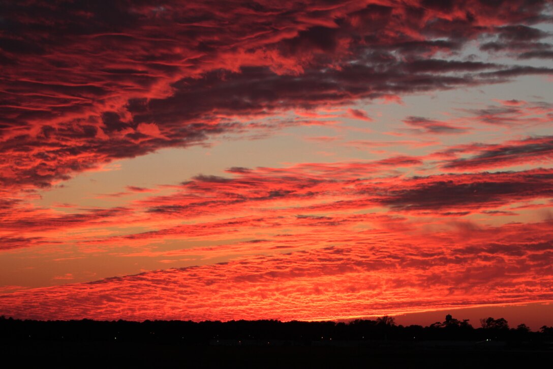 A southwest view shows a colorful sunset above Marine Corps Air Station Cherry Point, N.C., Nov. 18, 2014. 
Cherry Point is home to 2nd Marine Aircraft Wing and several of its squadrons. Cherry Point's runways operate 24/7, 365 days each year, and the air station hosts squadrons that specialize in air-to-ground attack support; electronic warfare; aerial transport and refueling; and sea and land search and rescue.  
