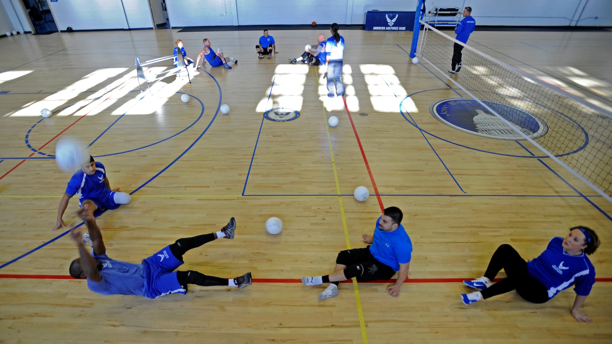 Air Force wounded, ill or injured warriors practice Nov. 18, 2014, at Joint Base Andrews, Md., for an upcoming Pentagon Sitting Volleyball Tournament. The one-day tournament is designed to bring awareness to the challenges of the wounded, ill or injured population. (U.S. Air Force photo/Tech. Sgt. Brian Ferguson)