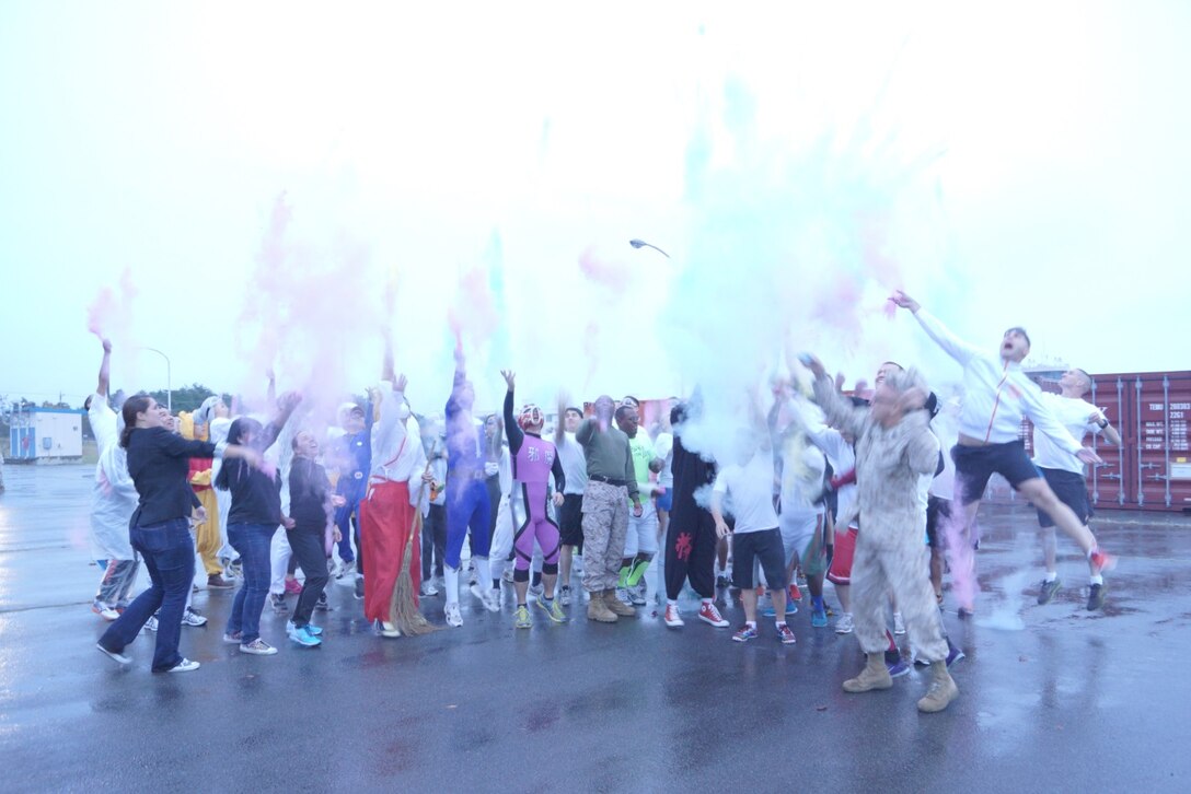 October 31 2014: Participants in the first ever Camp Fuji zombie run celebrate their completion with some color.  The event was sponsored by the U.S.O. and was held during the Camp Fuji Halloween celebration.