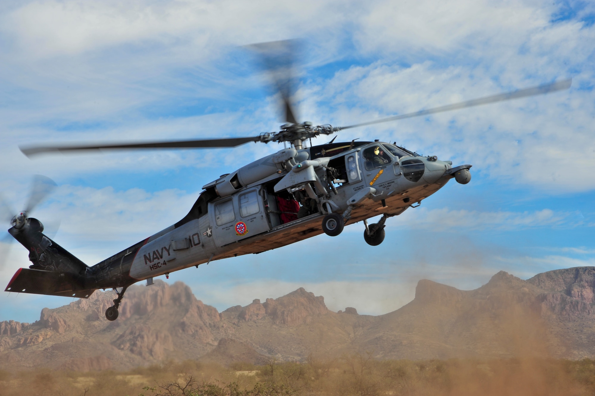 A U.S. Navy MH-60S Knighthawk from the Helicopter Sea Combat Squadron 4 Black Knights, lands at a military training range in Southern Arizona, Nov 14, 2014.  HSC-4 was detached to Davis-Monthan Air Force Base, Ariz., conducting joint operations training with A-10C Thunderbolt II squadrons and Combat Search and Rescue units.  (U.S. Air Force Photo by Airman 1st Class Chris Massey/Released)
