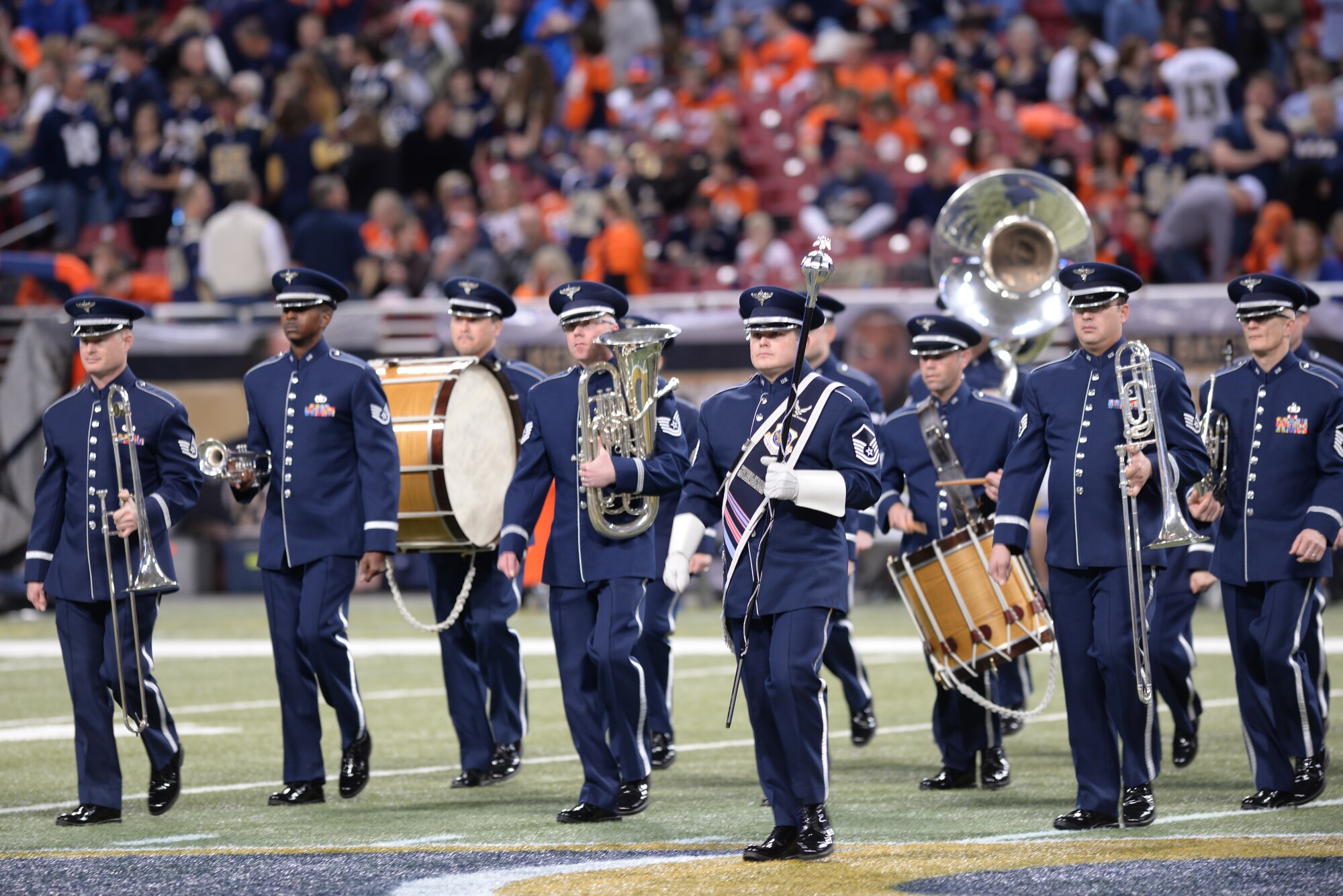 The U.S. Air Force Band of Mid-America march in a Pass-in-Review, where every branch of the Armed Forces were represented at Military Appreciation Day's halftime ceremony in the Edward Jones Dome, St. Louis, Nov. 16, 2014. The day included honoring wounded warriors as well as honor guards from every branch of the Armed Forces presenting the colors. The St. Louis Rams went up against the Denver Broncos, with the Rams winning 7-22. (U.S. Air Force photo by Airman 1st Class Erica Crossen)