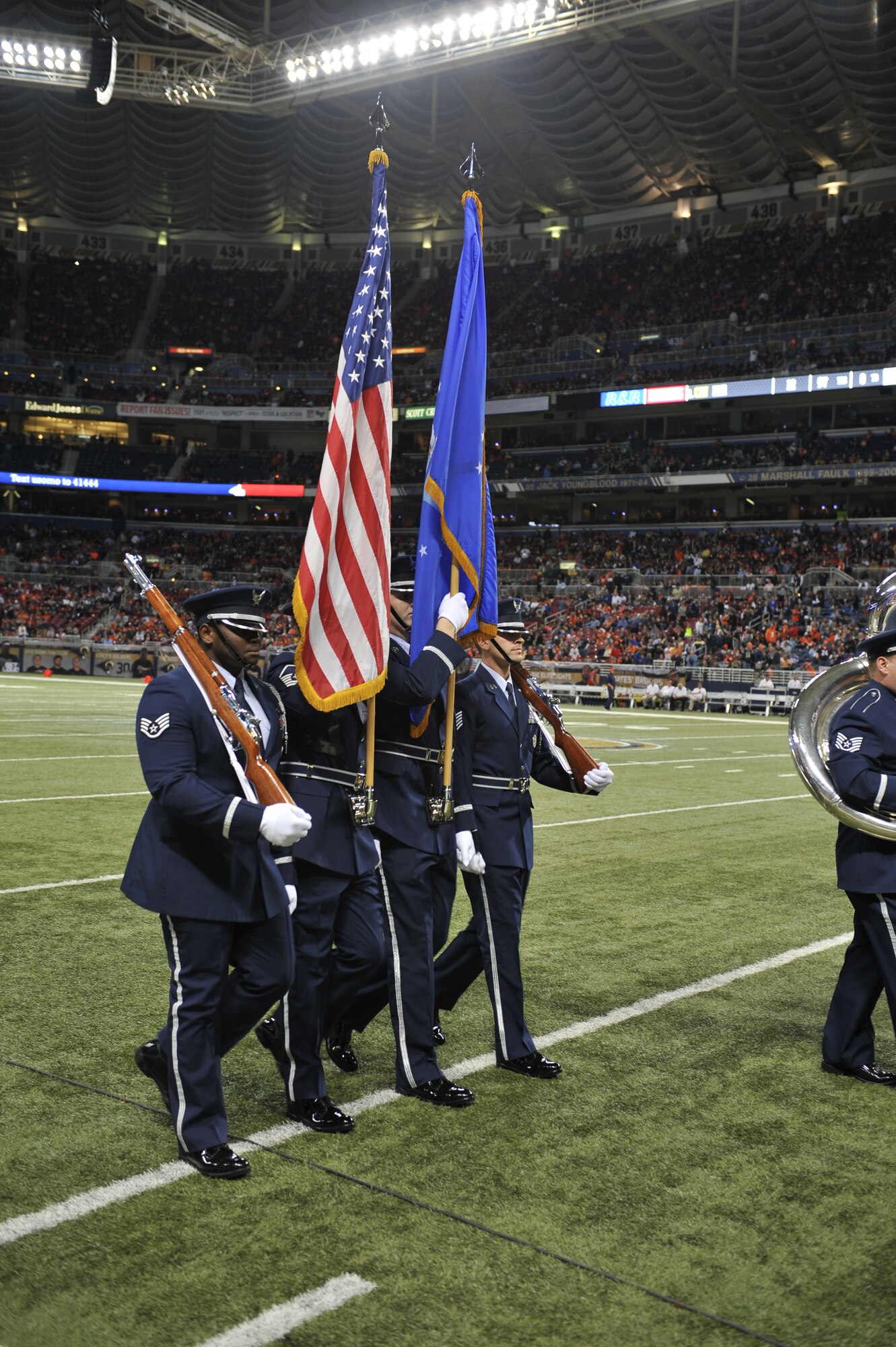 U.S. Air Force honor guard from Scott Air Force Base, Ill., march in a Pass-in-Review, where every branch of the Armed Forces were represented at Military Appreciation Day's halftime ceremony in the Edward Jones Dome, St. Louis, Nov. 16, 2014. The St. Louis Rams went up against the Denver Broncos, with the Rams winning 7-22. The day included honoring wounded warriors as well as honor guards from every branch of the Armed Forces presenting the colors. (U.S. Air Force photo by Airman 1st Class Erica Crossen)