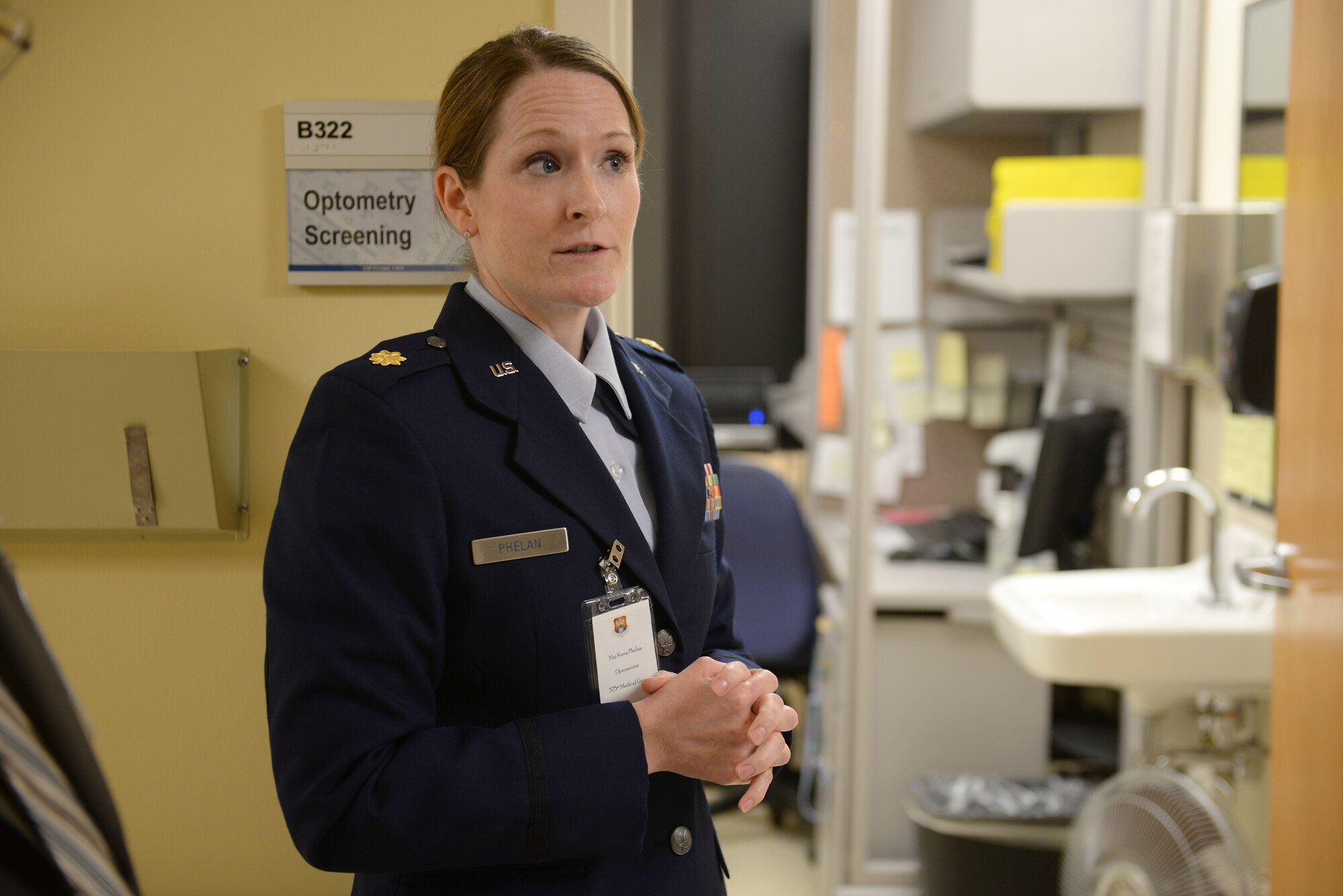Maj. Kerry Phelan, 375th Medical Group Optometrist, speaks to group of local provider representatives as they tour sections of the Scott Air Force Base Clinic during the 3rd Annual Network Provider’s Social, Scott AFB, Ill., Nov. 6, 2014. The social’s intention is to provide a venue for off-base providers and the 375th Medical Group to foster a working relationship, making off-base care for beneficiaries a smoother process. (U.S. Air Force photo by Airman 1st Class Erica Crossen)