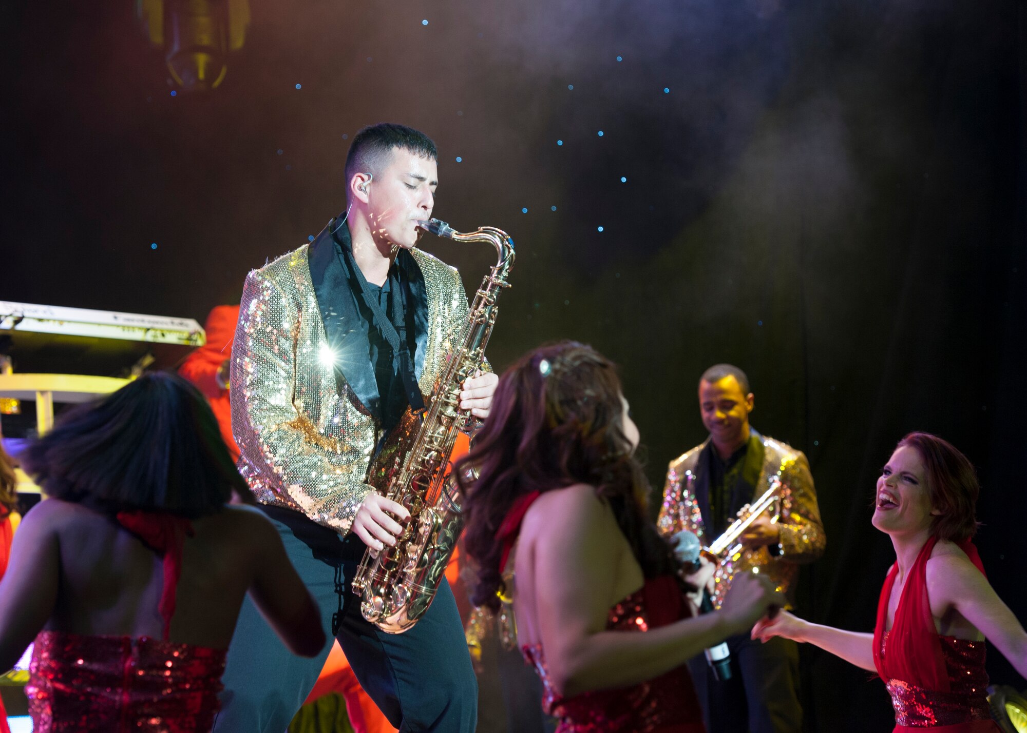 Senior Airman Gabriel Villaneuva, 436th Operations Support Squadron aircrew flight equipment, plays a saxophone during a Tops in Blue show Nov. 18, 2014, at the Delaware State University in Dover, Del. Villaneuva is currently the only Team Dover Airmen touring with Tops in Blues. (U.S. Air Force photo/Airman 1st Class Zachary Cacicia)