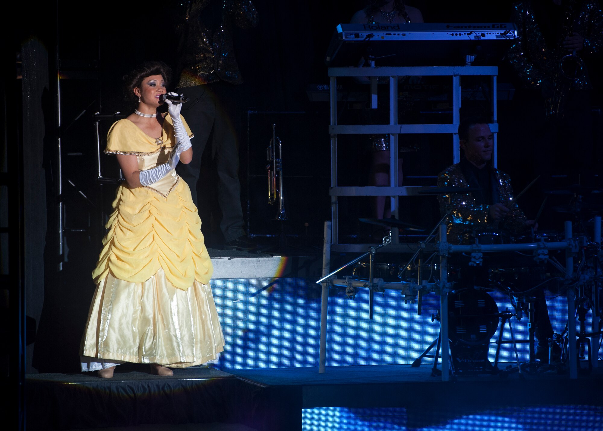 Staff Sgt. Gina Lavender, 149th Medical Group aerospace medical service, sings during a Tops in Blue show Nov. 18, 2014, at the Delaware State University in Dover, Del. Lavender is one of 38 Airmen currently touring with Tops in Blue. (U.S. Air Force photo/Airman 1st Class Zachary Cacicia)