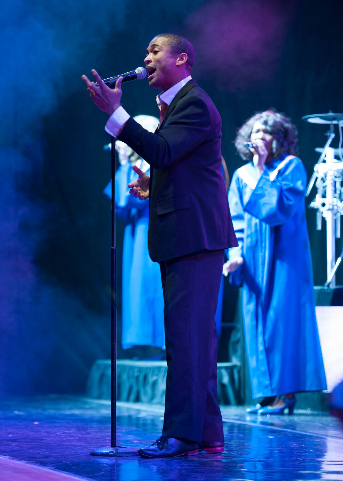 Senior Airman Charles Cooper, 509th Logistics Readiness Squadron vehicle operations, sings during a Tops in Blue show Nov. 18, 2014, at the Delaware State University in Dover, Del. This is the 60th year that Tops in Blue has been touring. (U.S. Air Force photo/Airman 1st Class Zachary Cacicia)