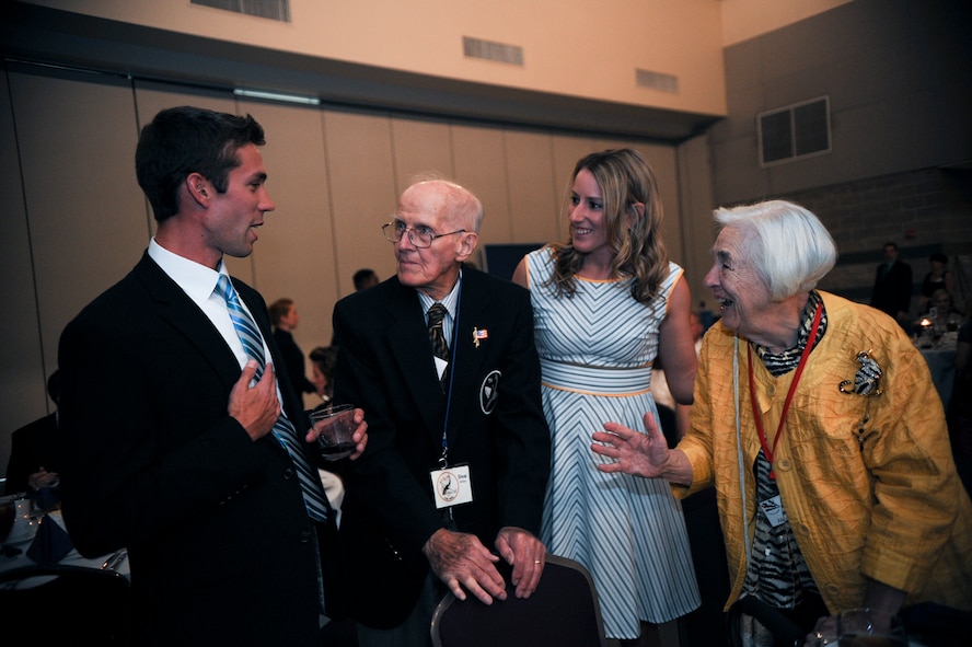 Don Miller, a former 75th Fighter Squadron pilot and World War II veteran, and his wife Alice, talk with U.S. Air Force Captains Ryan and Chandra Fleming during the 2014 Flying Tigers Reunion dinner Nov. 15, 2014, in Valdosta, Ga. The Flying Tiger Reunion, a three-day event, gave past and present Flying Tigers the opportunity to come together and celebrate the unit’s storied history. (U.S. Air Force photo by Andrea Jenkins/Released)