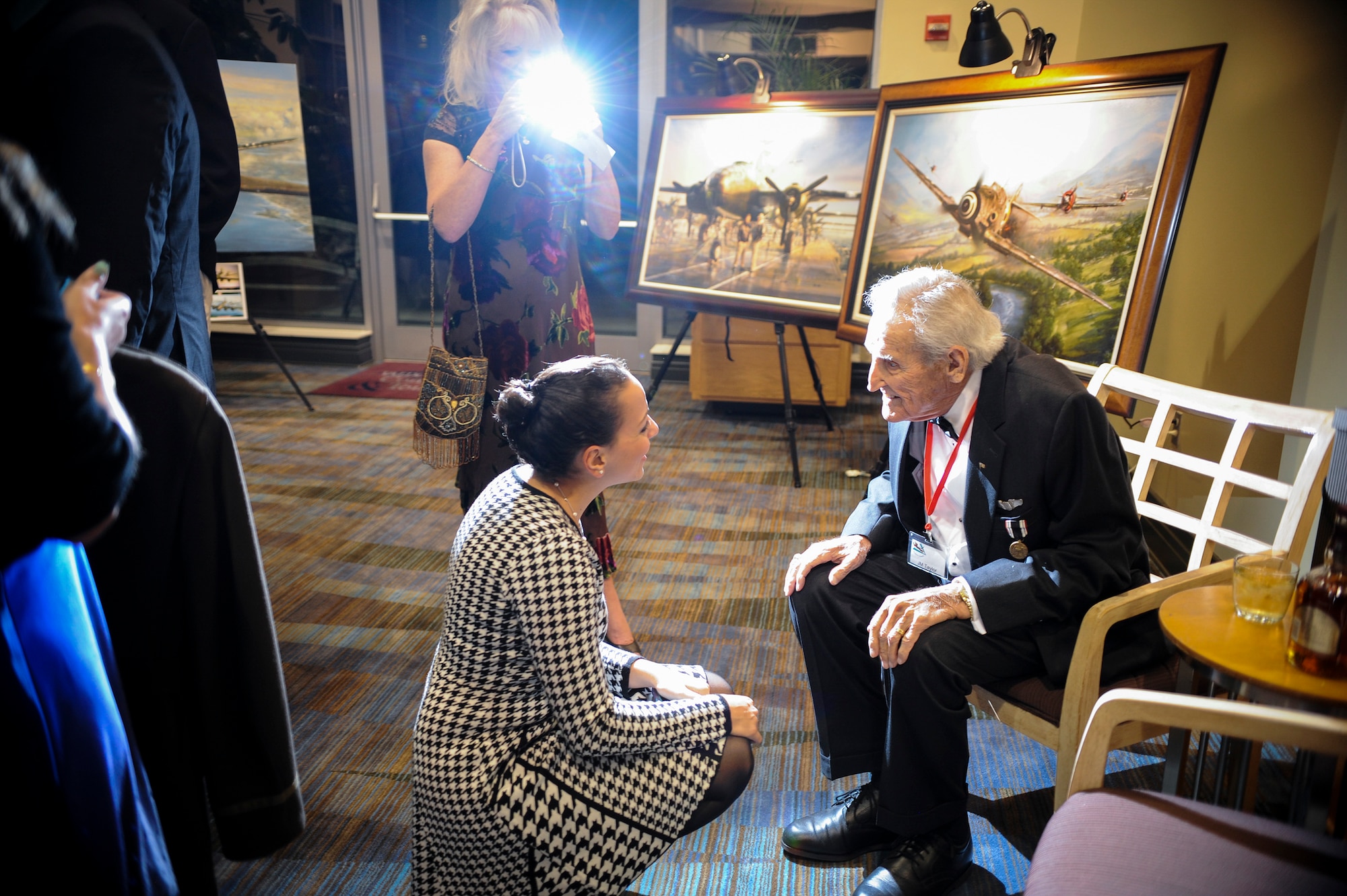 J.M. Taylor, a former 75th Fighter Squadron, talks about his time as a World War II prisoner of war during the 2014 Flying Tigers Reunion dinner Nov. 15, 2014, at the James H. Rainwater Conference Center in Valdosta, Ga. Taylor enlisted in the Army Cadet program on Sept. 16, 1942 and graduated flying training at Spence Field in Moultrie, Ga., Dec. 5, 1943. (U.S. Air Force photo by Andrea Jenkins/Released)