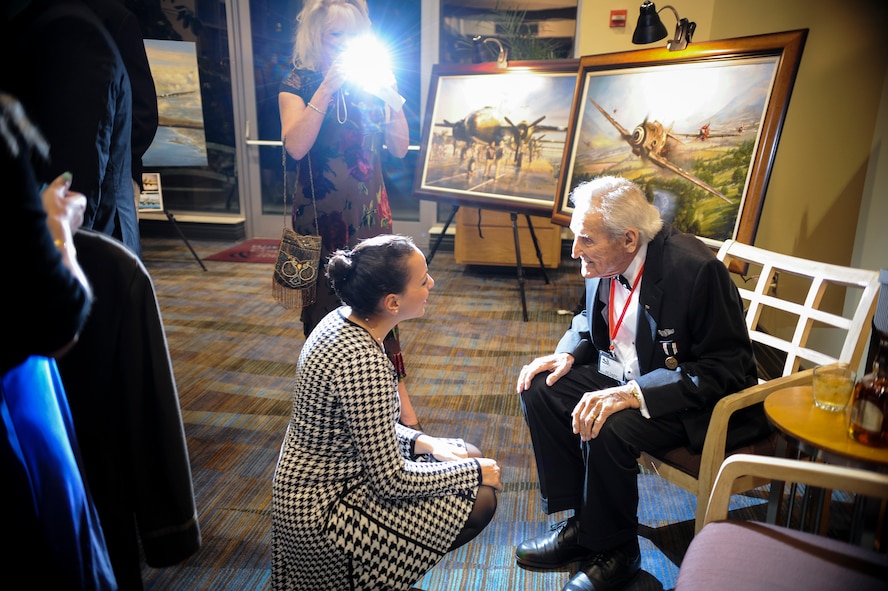 J.M. Taylor, a former 75th Fighter Squadron, talks about his time as a World War II prisoner of war during the 2014 Flying Tigers Reunion dinner Nov. 15, 2014, at the James H. Rainwater Conference Center in Valdosta, Ga. Taylor enlisted in the Army Cadet program on Sept. 16, 1942 and graduated flying training at Spence Field in Moultrie, Ga., Dec. 5, 1943. (U.S. Air Force photo by Andrea Jenkins/Released)