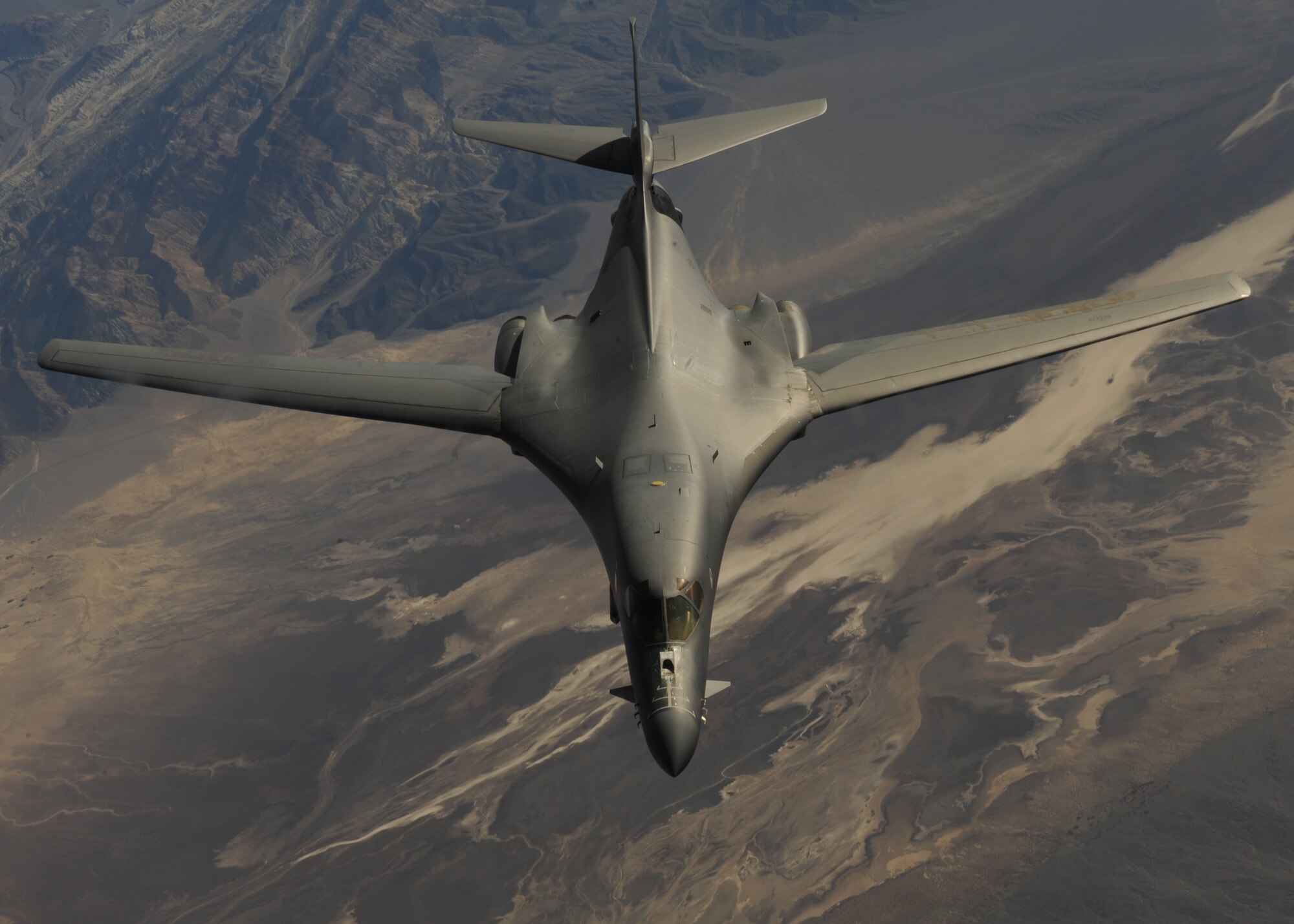 A B-1B Lancer assigned to the 34th Bomb Squadron, Ellsworth Air Force Base, S.D., disengages after being refueled by a KC-135 Stratotanker assigned to the 93rd Air Refueling Squadron, Fairchild AFB, Wash., during a Green Flag-West 15-02 training sortie over the Southern California desert, Nov. 18, 2014. In-flight refueling is a critical tool in maintaining air superiority around the globe. (U.S. Air Force photo by Airman 1st Class Joshua Kleinholz)