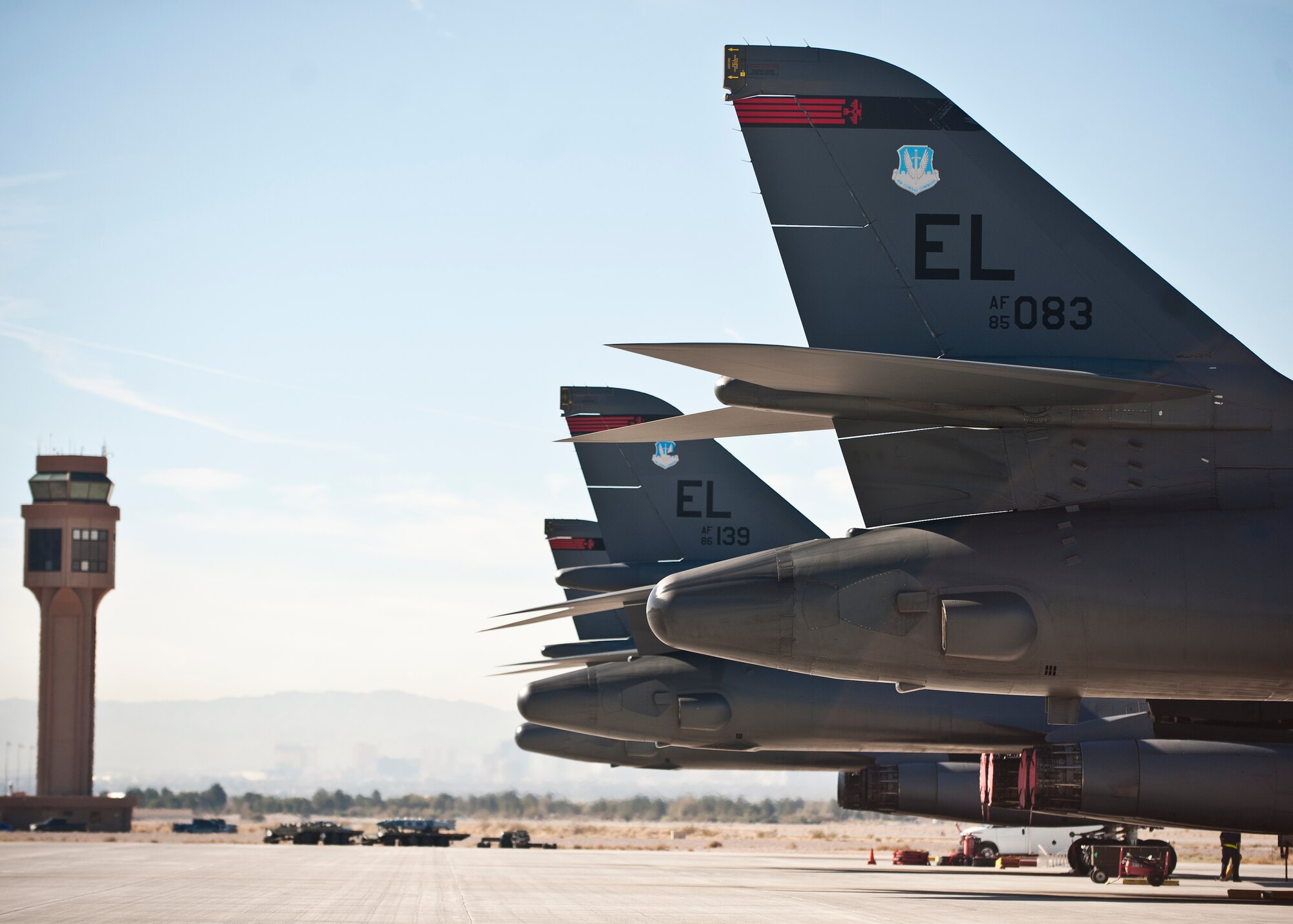 Three B-1B Lancers assigned to the 34th Bomb Squadron, Ellsworth Air Force Base, S.D., await post-flight inspections after flying a sortie during Green Flag-West 15-02 at Nellis AFB, Nev., Nov. 18, 2014. The B-1 can rapidly deliver massive quantities of precision and non-precision weapons against any adversary, anywhere in the world, at any time. (U.S. Air Force photo by Staff Sgt. Siuta B. Ika)