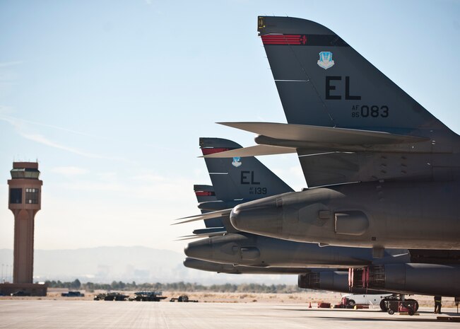 Three B-1B Lancers assigned to the 34th Bomb Squadron, Ellsworth Air Force Base, S.D., await post-flight inspections after flying a sortie during Green Flag-West 15-02 at Nellis AFB, Nev., Nov. 18, 2014. The B-1 can rapidly deliver massive quantities of precision and non-precision weapons against any adversary, anywhere in the world, at any time. (U.S. Air Force photo by Staff Sgt. Siuta B. Ika)