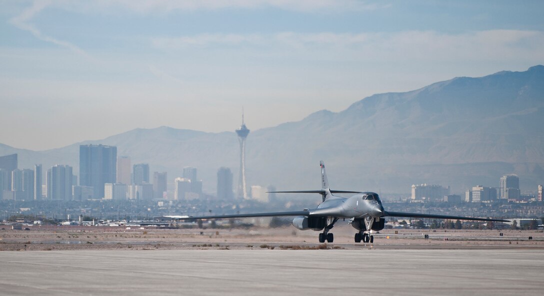 A B-1B Lancer assigned to the 34th Bomb Squadron, Ellsworth Air Force Base, S.D., taxis to its parking spot after landing during Green Flag-West 15-02 at Nellis AFB, Nev., Nov. 18, 2014. The B-1's blended body configuration, variable-geometry wings and turbofan afterburning engines combine to provide long range employment, maneuverability and high speed while enhancing survivability. (U.S. Air Force photo by Staff Sgt. Siuta B. Ika)