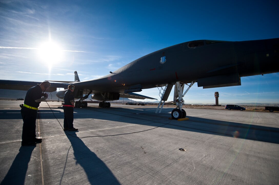 Two crew chiefs from the 34th Aircraft Maintenance Unit, Ellsworth Air Force Base, S.D., complete a pre-flight checklist on a B-1B Lancer assigned to the 34th Bomb Squadron, Ellsworth AFB, during Green Flag-West 15-02 at Nellis AFB, Nev., Nov. 18, 2014. Green Flag-West provides combat training to joint and coalition warfighters in the art of air-land integration and the joint employment of airpower at the U.S. Army National Training Center at Fort Irwin, Calif. (U.S. Air Force photo by Staff Sgt. Siuta B. Ika)