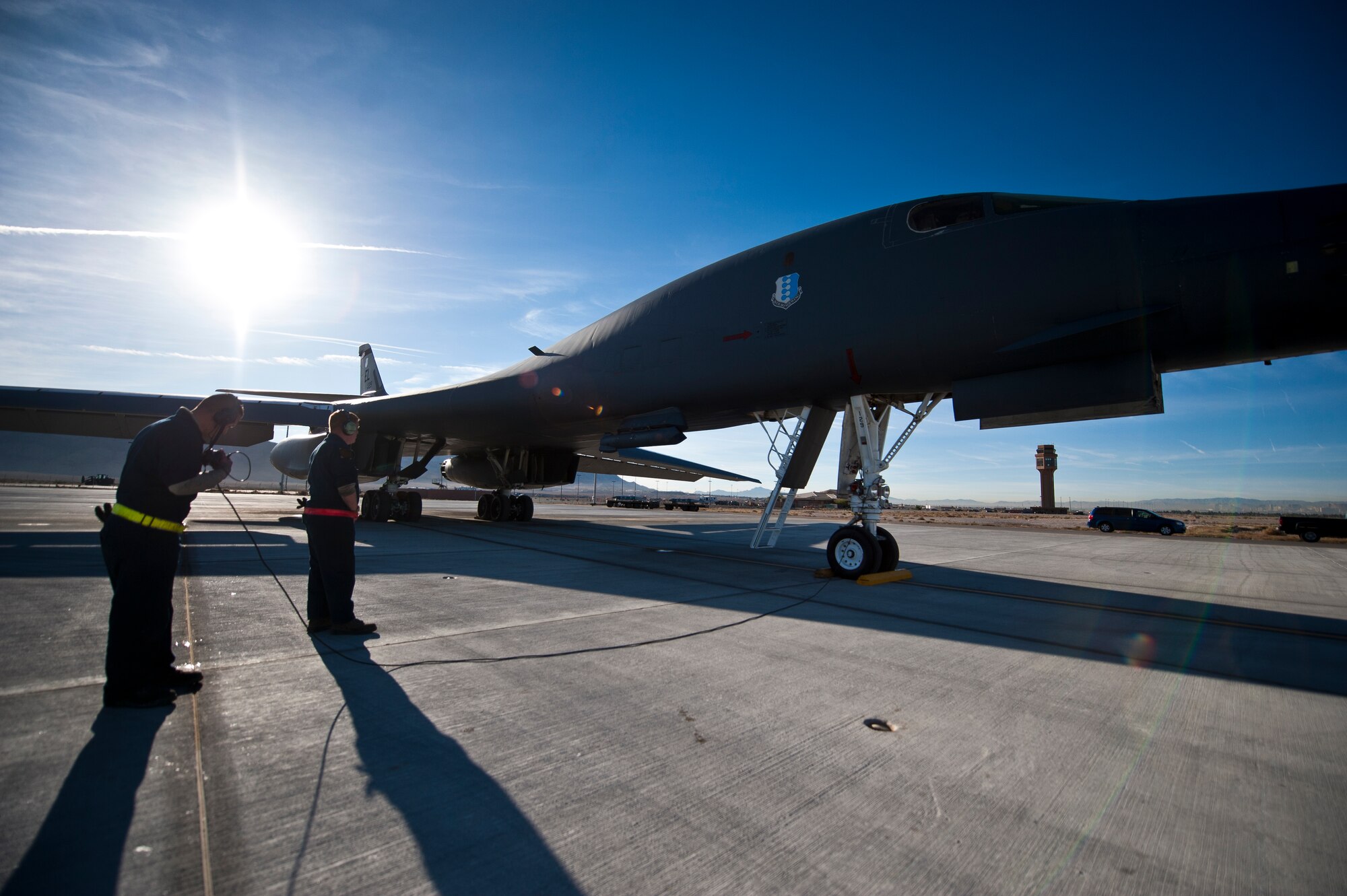 Two crew chiefs from the 34th Aircraft Maintenance Unit, Ellsworth Air Force Base, S.D., complete a pre-flight checklist on a B-1B Lancer assigned to the 34th Bomb Squadron, Ellsworth AFB, during Green Flag-West 15-02 at Nellis AFB, Nev., Nov. 18, 2014. Green Flag-West provides combat training to joint and coalition warfighters in the art of air-land integration and the joint employment of airpower at the U.S. Army National Training Center at Fort Irwin, Calif. (U.S. Air Force photo by Staff Sgt. Siuta B. Ika)