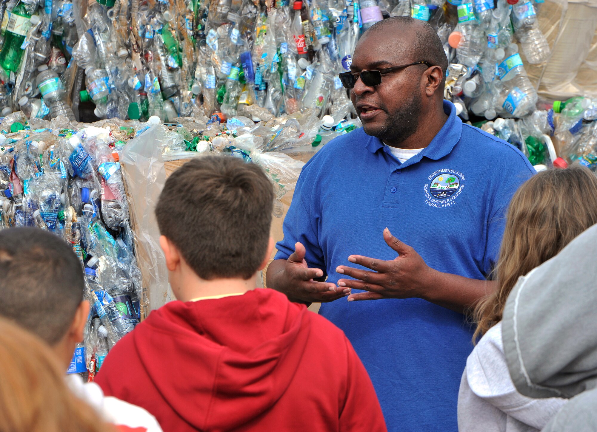 Edwin Wallace, 325th Civil Engineer Squadron recycling program manager, talks to Tyndall Elementary students Nov. 13 about the importance of recycling. More than 60 students toured the Tyndall Recycling Center and Natural Resources office, learning about the different items recycled and the different trees and animals tha are native to the base. (U.S. Air Force photo by Airman 1st Class Sergio A. Gamboa) 