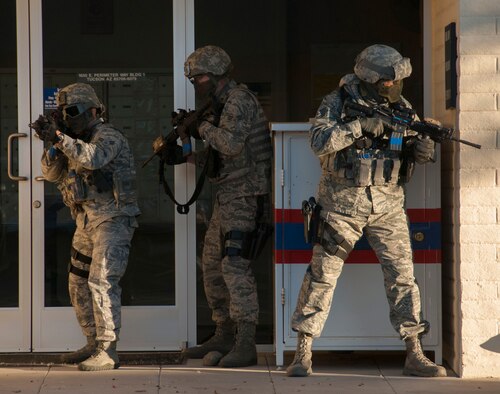 Airmen assigned to the 162nd Wing Security Forces squadron clear the perimeter of the wing’s post office Nov. 17. Security forces, alongside other agencies, participated in the exercise to prepare and measure their capabilities in the event of an active shooter.    