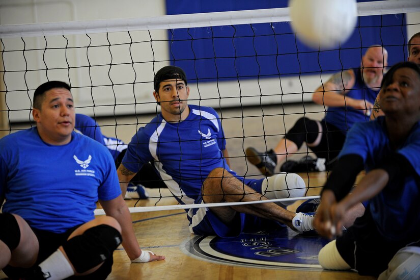 Air Force wounded warrior Staff Sgt. August O'Niell waits to make a play during practice at the Joint Base Andrews West Fitness Center, Nov. 18, for an upcoming Pentagon Sitting Volleyball Tournament. The one-day tournament is designed to bring awareness to the challenges of the wounded, ill or injured population. (U.S. Air Force photo/Tech. Sgt. Brian Ferguson)