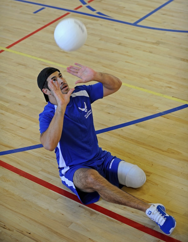 Air Force wounded warrior Staff Sgt. August O'Niell sets a volleyball during practice at the Joint Base Andrews West Fitness Center, Nov. 18, for an upcoming Pentagon Sitting Volleyball Tournament. The one-day tournament is designed to bring awareness to the challenges of the wounded, ill or injured population. (U.S. Air Force photo/Tech. Sgt. Brian Ferguson)
