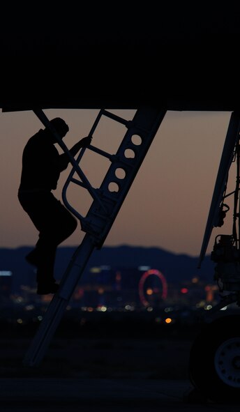 Senior Airman Nick Lunde, 28th Bomb Wing, 28th Aircraft Maintenance Squadron, Ellsworth Air Force Base, S.D., crew chief, perform final checks prior to launch during RED FLAG 14-3 on Nellis AFB, Nev., July 14, 2014. RED FLAG is a realistic combat training exercise involving the air forces of the U.S. and its allies. (U.S. Air Force photo by Tech. Sgt. Jerry Fleshman/Released)