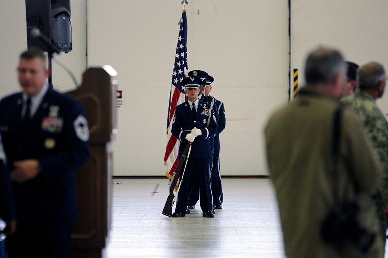 Master Sgt. Thomas Barjaktarovich and members of the 127th Wing Honor Guard present the colors during the 127th Wing Change of Command ceremony, in which Brig. Gen. John D. Slocum took command of the wing, Nov. 2, 2014, at Selfridge Air National Guard Base, Mich. In addition to serving as a color guard at ceremonial events, the 127th Wing Honor Guard renders final honors to Air Force veterans at about 300 funerals per year. (U.S. Air National Guard photo by Tech. Sgt. Robert Hanet)