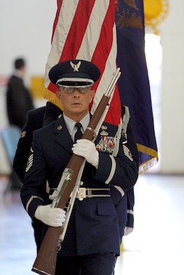 Master Sgt. Thomas Barjaktarovich and members of the 127th Wing Honor Guard present the colors during the 127th Wing Change of Command ceremony, in which Brig. Gen. John D. Slocum took command of the wing, Nov. 2, 2014, at Selfridge Air National Guard Base, Mich. In addition to serving as a color guard at ceremonial events, the 127th Wing Honor Guard renders final honors to Air Force veterans at about 300 funerals per year. (U.S. Air National Guard photo by Tech. Sgt. Robert Hanet)