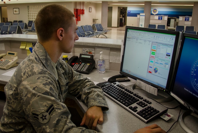 Airman 1st Class Nicolas Hrabley, 437th Airlift Wing Aerial Port Squadron passenger service agent, checks the availability of upcoming flights for passengers Nov. 17, 2014, at Joint Base Charleston, S.C. Hrabley will send email notification for individuals signed up for “Virtual Roll Call” to aid in the Space-A process. (U.S. Air Force photo / Senior Airman Tom Brading)
