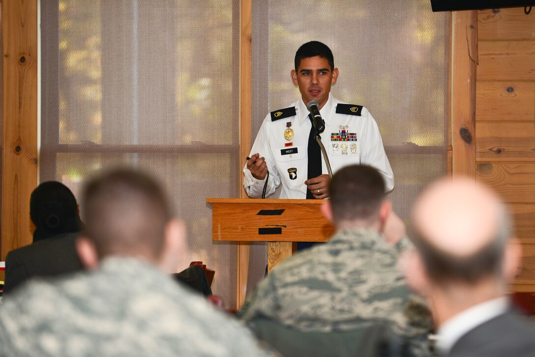 U.S. Army Staff Sgt. Christopher West, Behavioral Health Services noncommissioned officer in charge, speaks during a sexual assault prevention and response summit at Fort Eustis, Va., Nov. 14, 2014. West discussed assertiveness, risk recognition, psychological barriers and how victims can protect themselves from becoming re-victimized. (U.S. Air Force photo by Senior Airman Kimberly Nagle/Released)