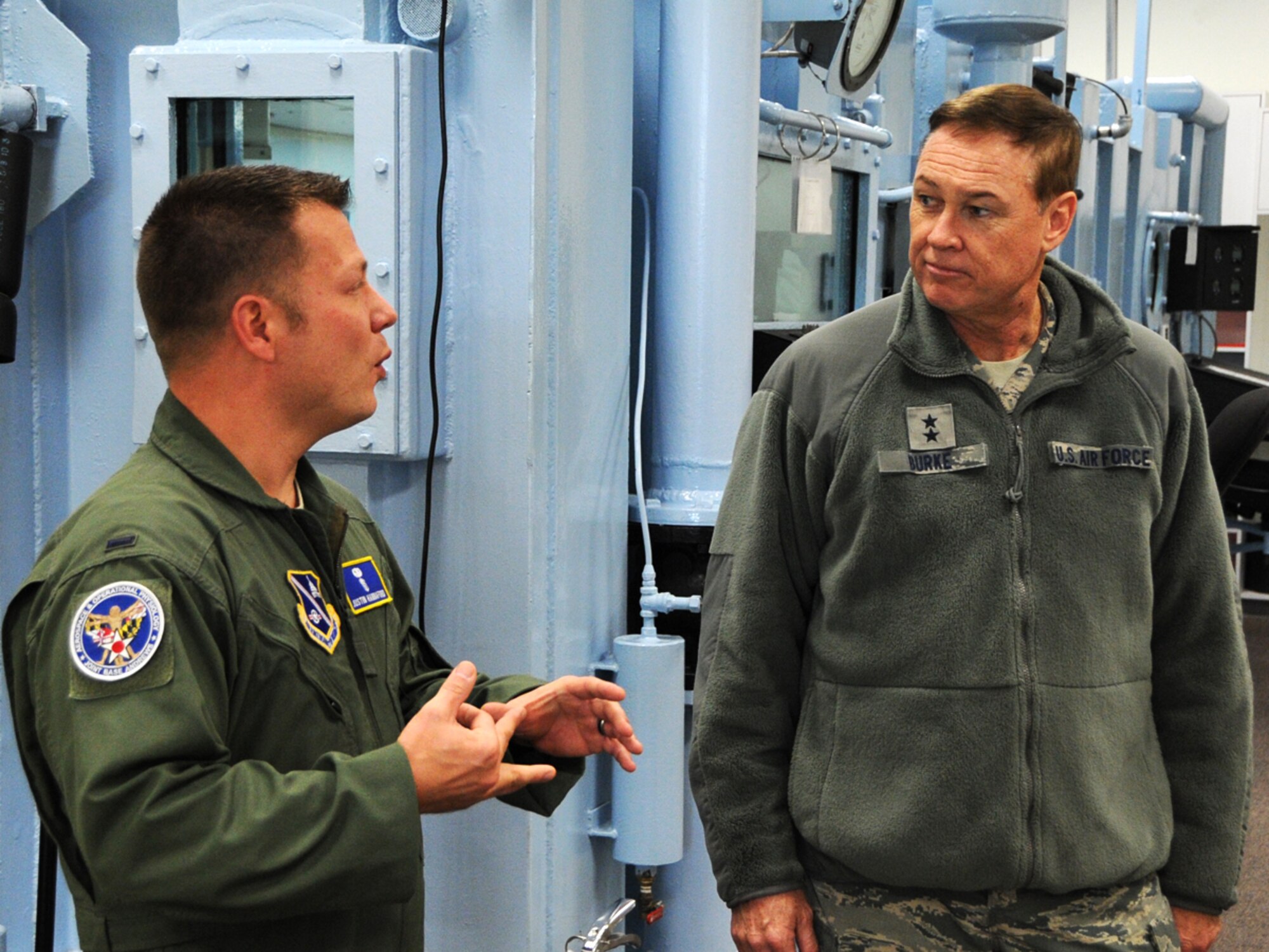 1st. Lt. Justin Hannaford, 79th MDW Aerospace and Operational Training Flight, briefs Major Generals Darryl Burke, Air Force District of Washington commander, at Malcom Grow Medical Center on Joint Base Andrews, Md., Nov. 18, 2014. Burke visited medical facilities and met staff during his 779th Medical Group immersion tour. (U.S. Air Force photo/Staff Sgt. Matt Davis)