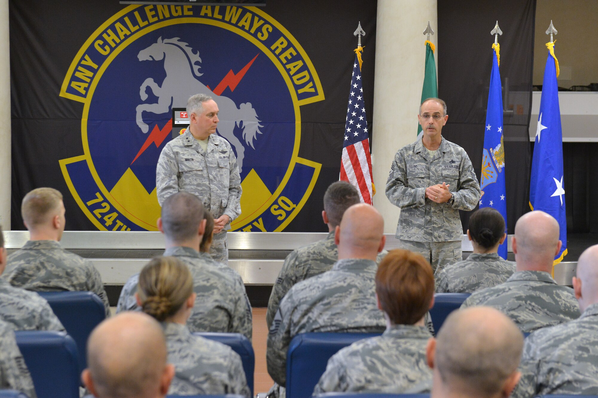 Maj. Gen. Frederick Martin and Chief Master Sgt. Pete Stone, U.S. Air Force Expeditionary Center commander and command chief, speak to 724th Air Mobility Squadron Airmen during an all-call, Nov. 19, 2014, at Aviano Air Base, Italy. Martin toured the AMS facilities and congratulated the unit for receiving Small Terminal of the Year from the 521st Air Mobility Operations Wing, Ramstein Air Base, Germany. (U.S. Air Force photo/Airman 1st Class Ryan Conroy) 