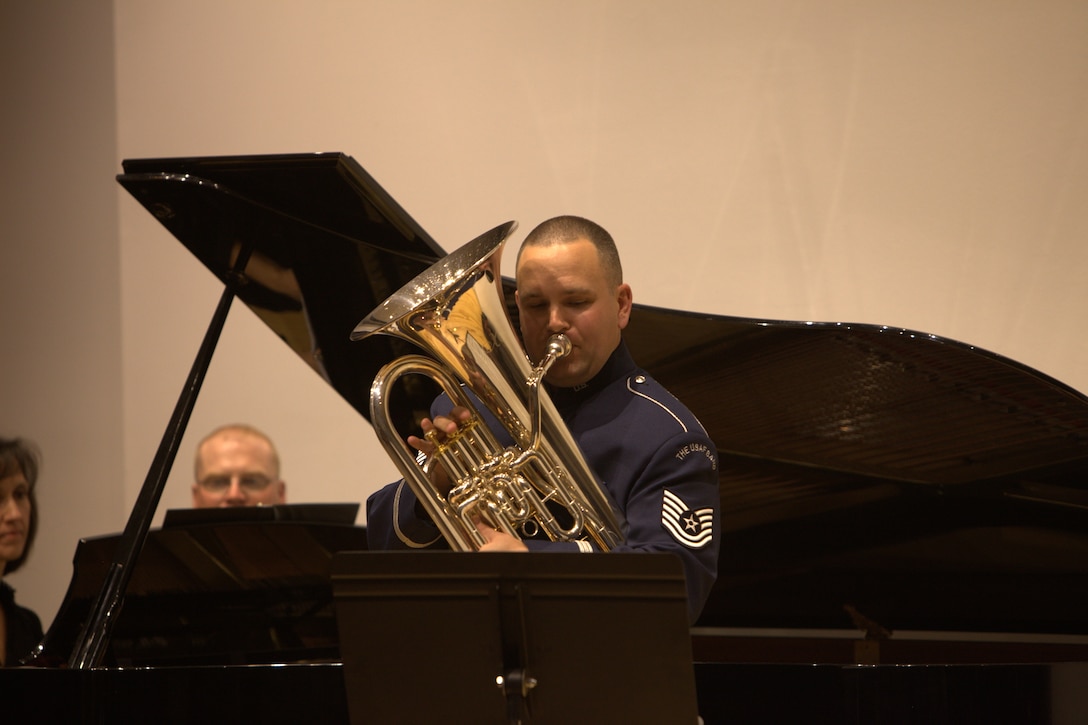 The newest member of the Ceremonial Brass, Tech. Sgt. Brandon Jones, performs a solo with Lisa Gibbs-Smith, piano, at The Lyceum in Old Town Alexandria on November 6, 2014. (U.S. Air Force photo by Tech. Sgt. Matthew Shipes)
