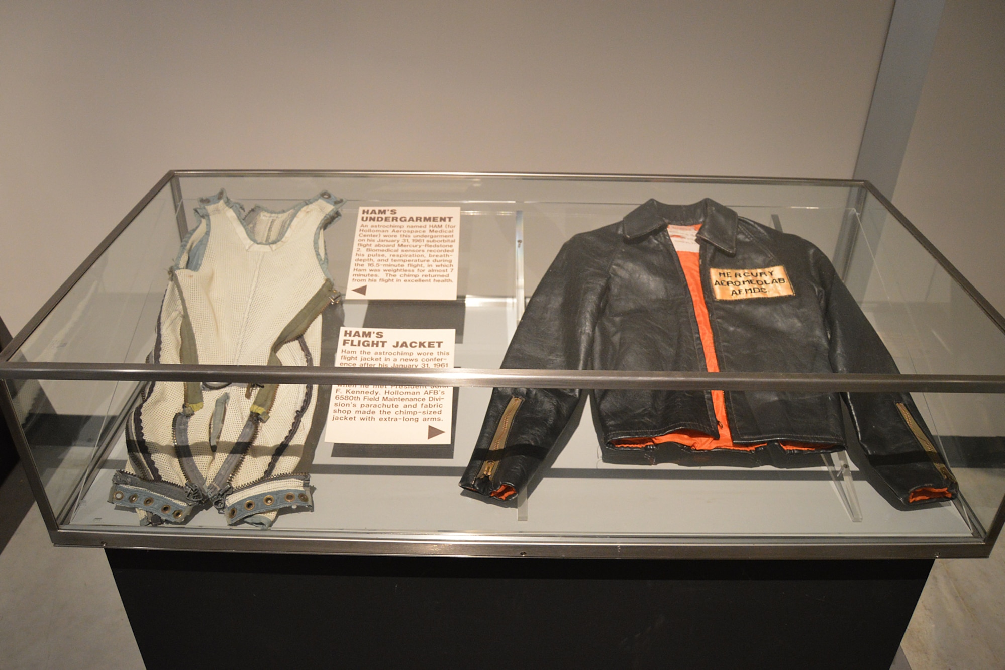DAYTON, Ohio - HAM's undergarment and flight jacket on display in the Missile & Space Gallery at the National Museum of the U.S. Air Force. (U.S. Air Force photo)