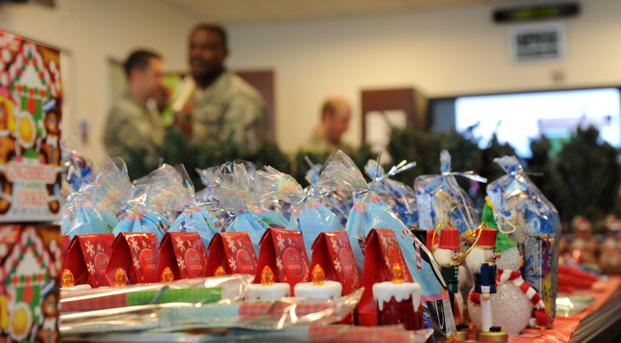 Items for the Air Force District of Washington holiday care packages sit sorted and ready for packing at Joint Base Andrews, Md., Nov. 17, 2014. Four times a year, the AFDW unit deployment manager, Annette Bonaro, coordinates the creation of themed care packages for each Airman deployed from the command and those adopted by the command. (U.S. Air Force photo/Master Sgt. Tammie Moore)